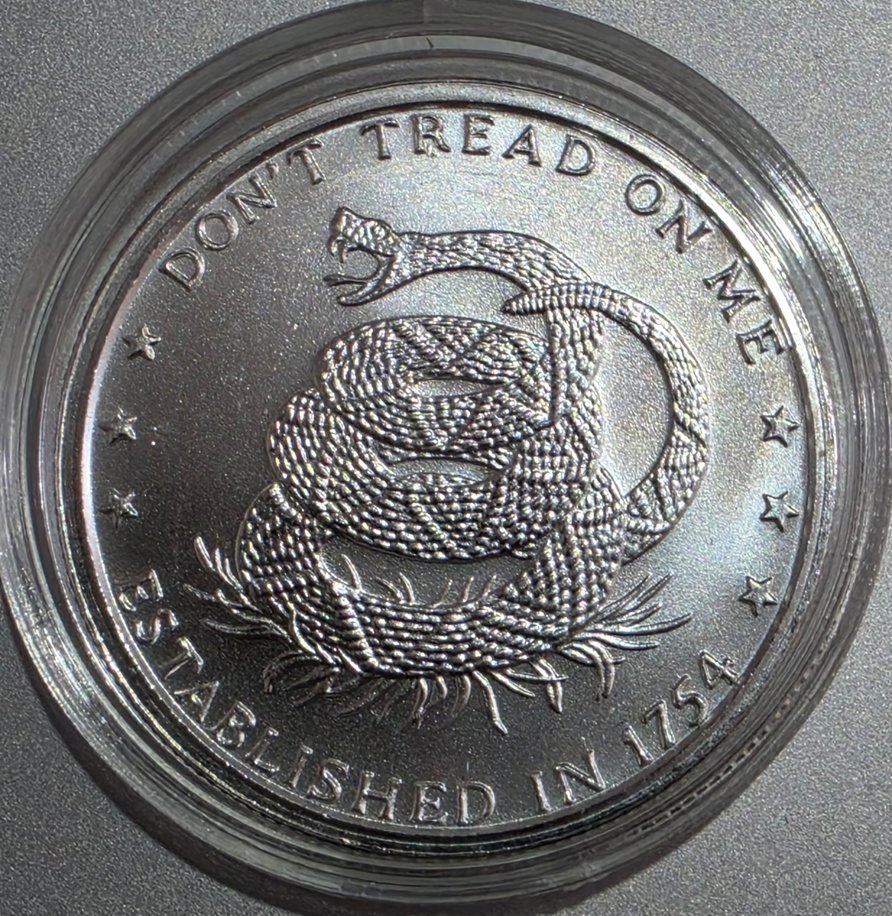 1 oz silver round featuring the "Don't Tread on Me" rattlesnake design